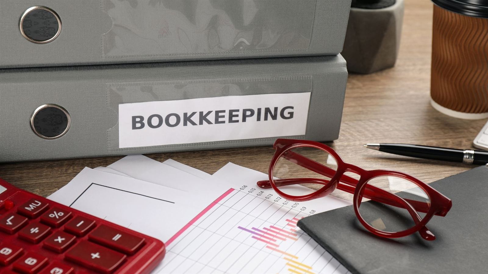 Payroll bookkeeping folders and calculator